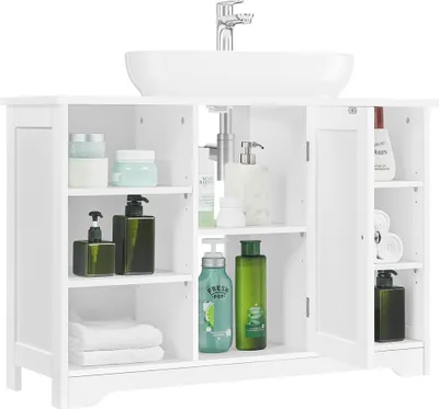 A white bathroom vanity cabinet with a sink on top, filled with various toiletries and towels.