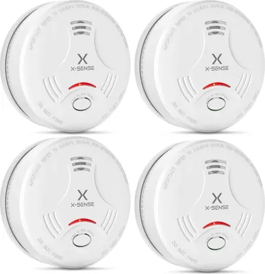 Four white X-Sense smoke detectors arranged in a 2x2 grid against a white background.