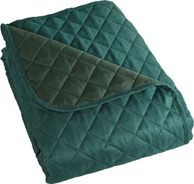 A folded teal quilted blanket with a darker teal underside.