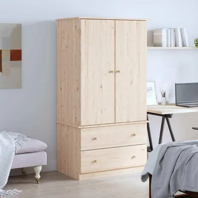 A wooden wardrobe with two doors and two drawers, placed in a room with a desk and a bench.