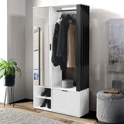 A modern hallway wardrobe set with a mirror, clothes hanging, and storage compartments, set against a neutral wall.