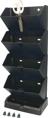 A black vertical planter with four tiers and a base, with a pair of scissors in the top tier.