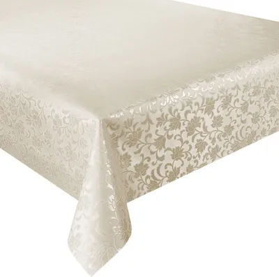 A tablecloth with a floral pattern draped over a table corner.