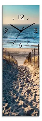 A path leading to a beach with the ocean in the background, featuring a clock face overlaid on the scene.