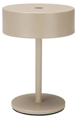 Gesamtansicht der kabellos aufladbaren Tischlampe Mini Brown Rice in Beige mit zylindrischem Schirm und rundem Standfuß.