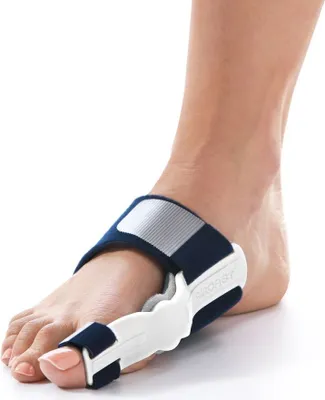 A close-up shot of a person's foot wearing a medical brace for hallux valgus (bunion).