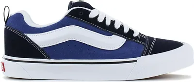 A side view of a blue and white Vans Knu Skool sneaker.