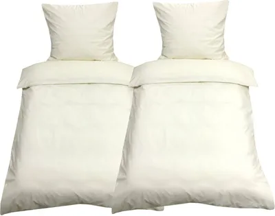 Two cream-colored duvet covers and pillowcases are displayed side-by-side against a white background.