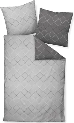A flat lay of a duvet cover and two pillowcases with a diamond pattern.
