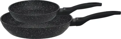 A set of two black frying pans with speckled grey and white interiors and black handles, stacked on a white background.
