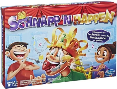 The image shows the box art for the board game "Schnapp 'n Happen". It features cartoon characters and game elements.