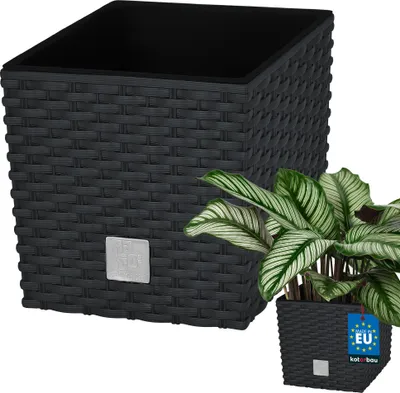 A black woven planter with a smaller potted plant in front of it.