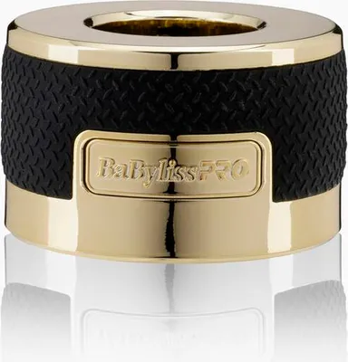 A close-up studio shot of a gold and black hair trimmer attachment.