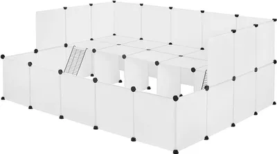 A modular white enclosure, possibly for pets, with multiple levels and ramps.