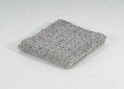 A folded gray towel is shown on a white background.