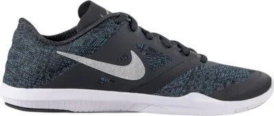 A side view of a Nike women's sports shoe.
