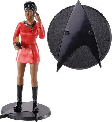 A Star Trek Uhura figurine and a Starfleet insignia.