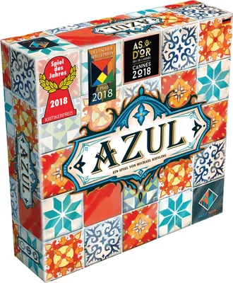 A board game box with a tile-based design and award badges.