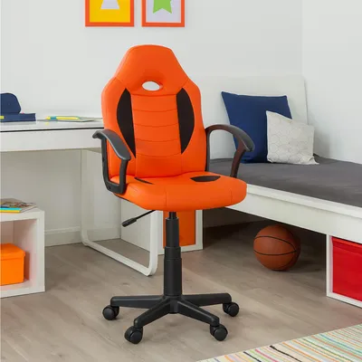 A child's bedroom with a desk and a bed.