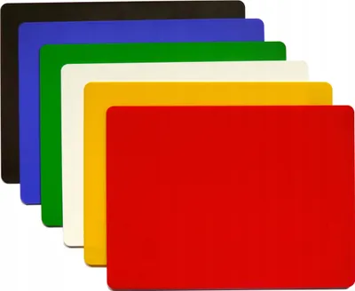 A set of six plastic cutting boards in different colors, stacked diagonally.