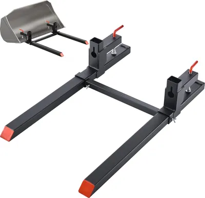 A product shot of pallet forks for a tractor, shown against a white background. A smaller inset image shows the forks attached to a loader bucket.