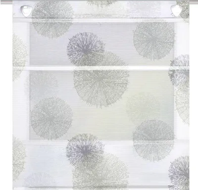 A close-up view of a roman blind with a dandelion-like pattern.