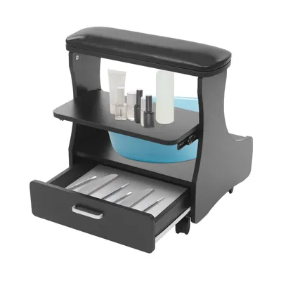 A manicure station with an armrest, storage shelf, and a drawer filled with manicure tools.