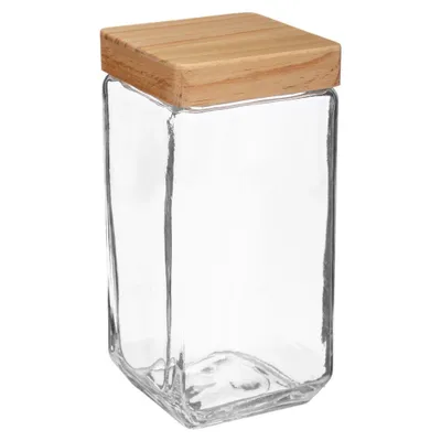 A clear glass jar with a wooden lid.