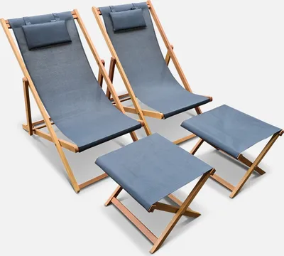 Two grey deck chairs and two matching footrests are arranged on a white background.