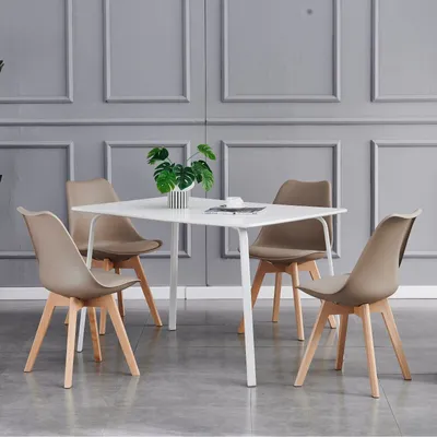 A dining set with a square table and four chairs in a room with gray paneled walls.