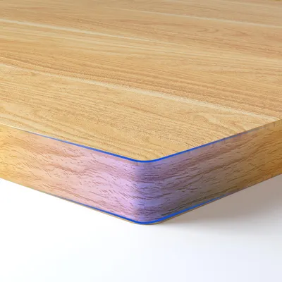 Close-up of the edge of a wooden desk or tabletop.