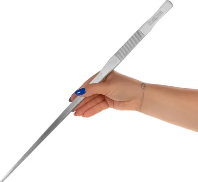 A hand holding a long pair of tweezers against a white background.