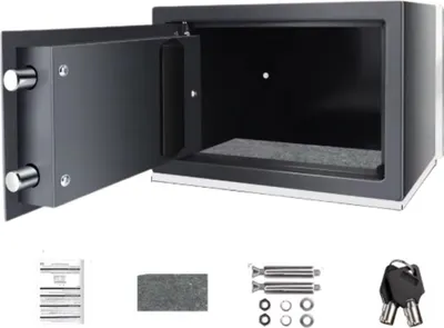An open safe with its accessories laid out below.