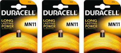 Three packages of Duracell MN11 batteries are displayed side-by-side.