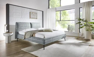 Produktbild von Meise Möbel Polsterbett Infinity 160x200 cm | Doppelbett | Bettgestell | Kopfteil in Kissenoptik | Webstoff Ozeanblau | Metallfuß schwarz