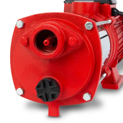 A close-up, front-facing view of a red centrifugal pump.