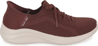 A side view of a red Skechers slip-on sneaker with a beige sole.