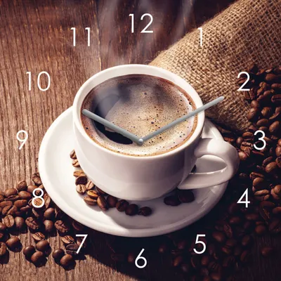 A clock face designed to look like a coffee cup with coffee beans and a burlap sack in the background.