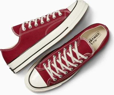 A pair of red Converse Chuck 70 sneakers.