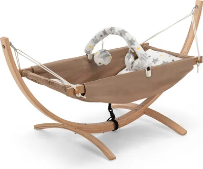 A baby hammock on a wooden stand, with a mobile toy above it.