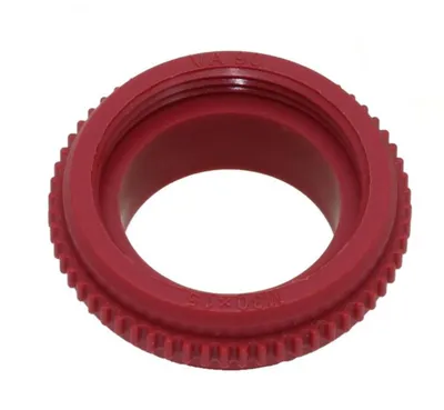 A red plastic fitting with text on it, isolated on a white background.