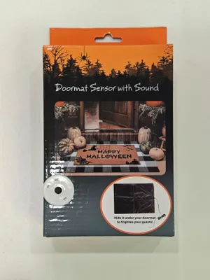 The image shows the packaging for a Halloween doormat sensor with sound.