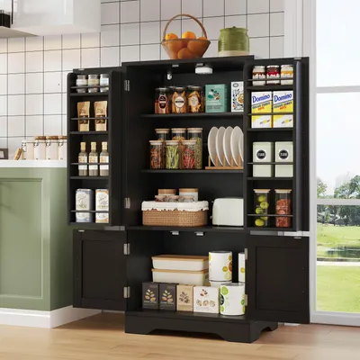 A dark brown kitchen pantry cabinet filled with various food items and kitchenware, placed in a kitchen setting with a window view of greenery.