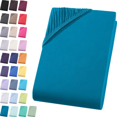 A teal fitted sheet is shown folded, with a swatch of other colors displayed to the left.