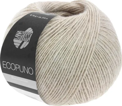 A ball of beige yarn with a black label.
