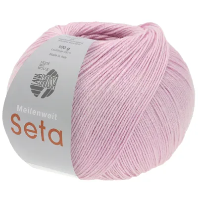 A ball of pink yarn with a label.