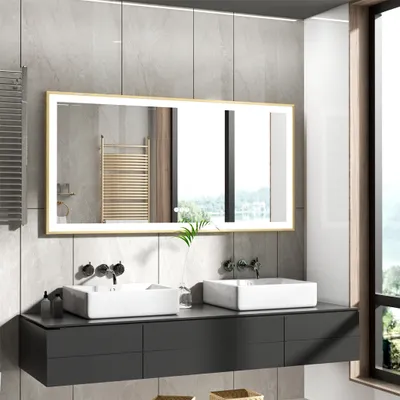 A modern bathroom vanity with two sinks and a large illuminated mirror.