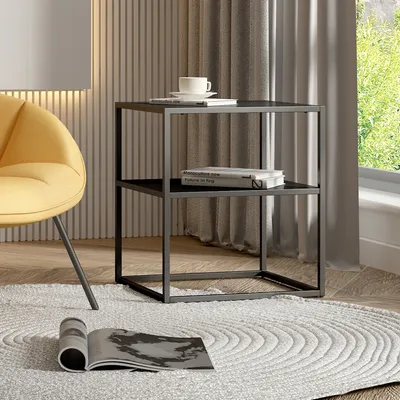 A modern living room scene with a yellow armchair and a black metal side table.