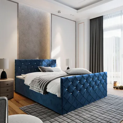 A bedroom scene with a blue upholstered bed as the main focus.