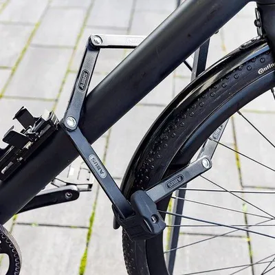 Produktbild von Famanu Falt-Schloss 6000K mit SH Halter - Faltbares Fahrradschloss mit XPlus Zylinder für hohe Manipulationssicherheit - Sicherheitsniveau 10 - Länge